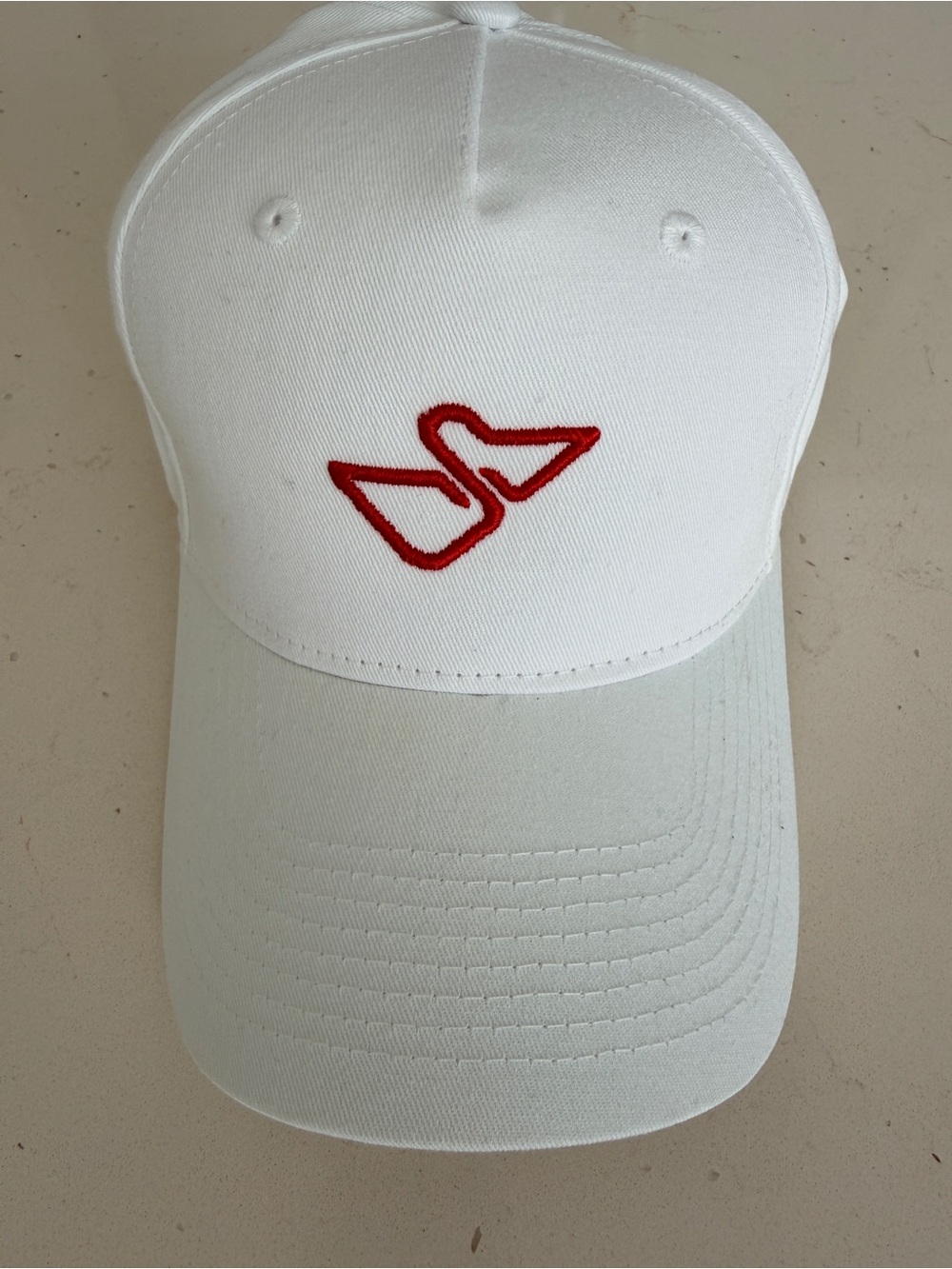 Il Pellicano ISSIMO White Baseball Cap with Red Hotel Embroidered Logo